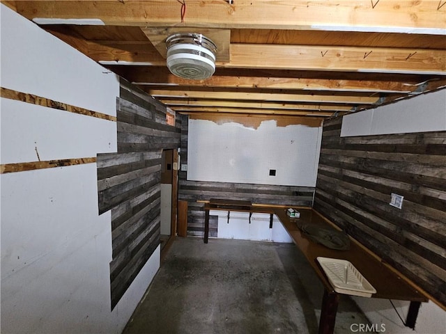 unfinished below grade area with wood walls