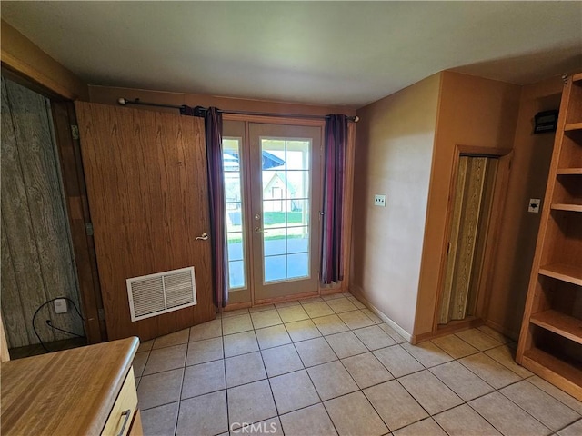 entryway with visible vents and light tile patterned floors