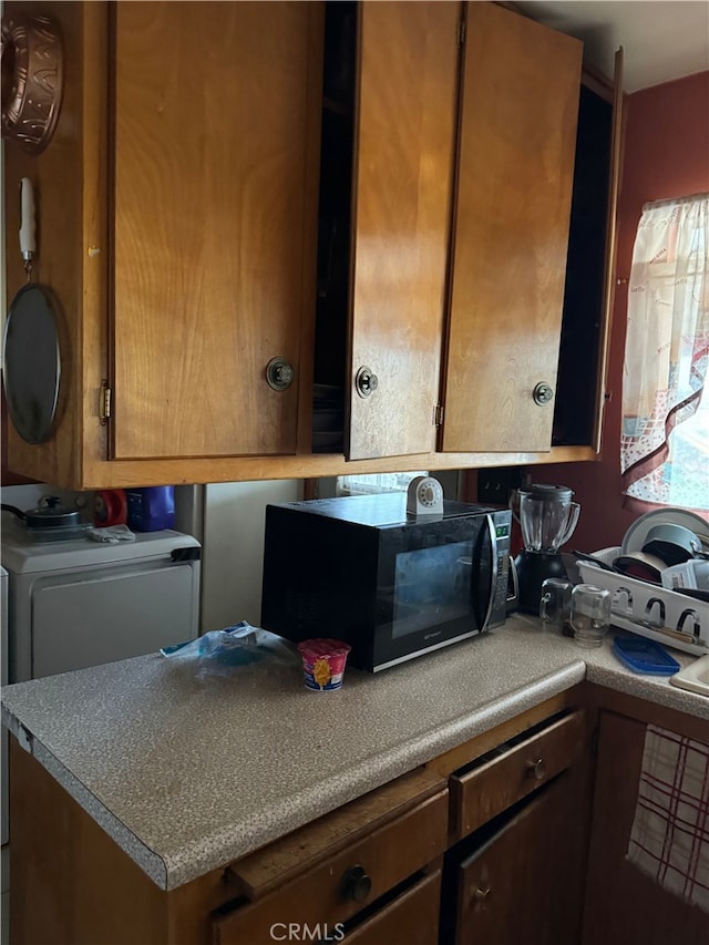 kitchen featuring washer / dryer