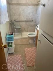 bathroom featuring toilet