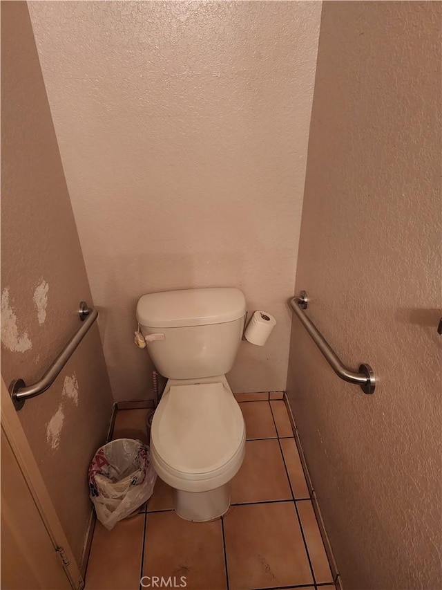 bathroom with tile patterned flooring and toilet