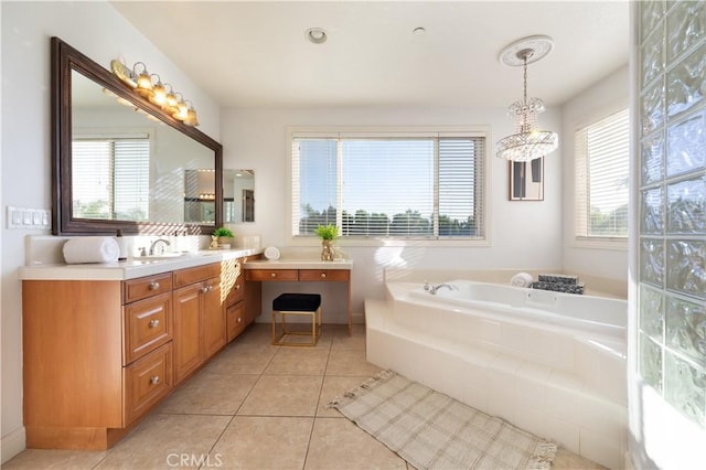 bathroom with tile patterned flooring, a relaxing tiled tub, and vanity