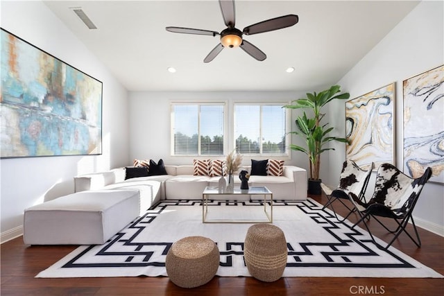 living room featuring vaulted ceiling, ceiling fan, and dark hardwood / wood-style flooring