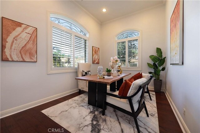 home office with dark wood-type flooring and ornamental molding