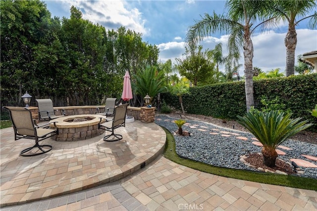 view of patio featuring an outdoor fire pit