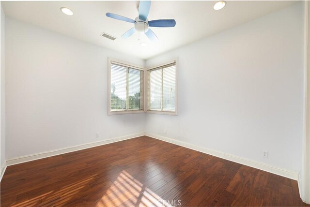 spare room with ceiling fan and hardwood / wood-style floors