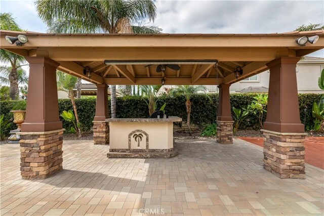 view of patio with a bar and a gazebo