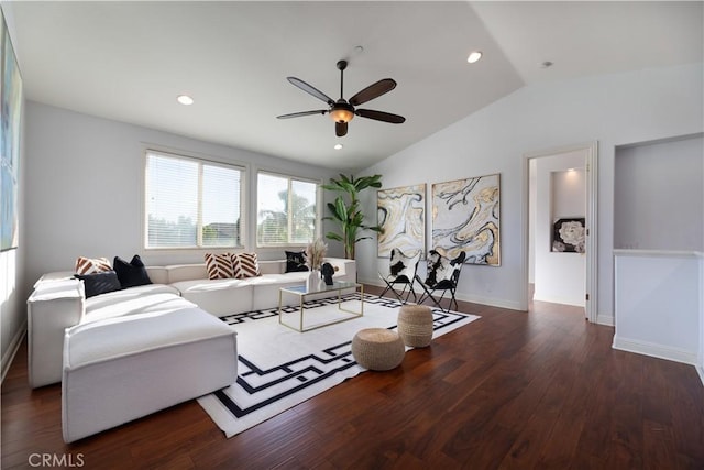 living room with ceiling fan, vaulted ceiling, and dark hardwood / wood-style flooring