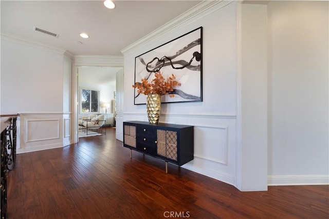 hallway featuring dark hardwood / wood-style floors and ornamental molding