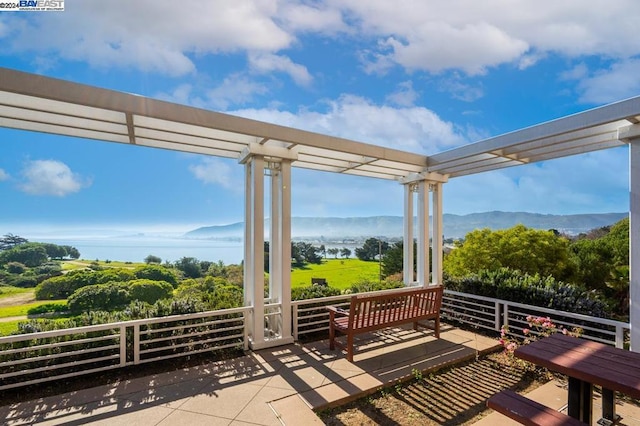 view of patio / terrace featuring a mountain view and a pergola