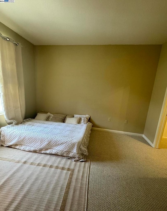 unfurnished bedroom featuring carpet flooring