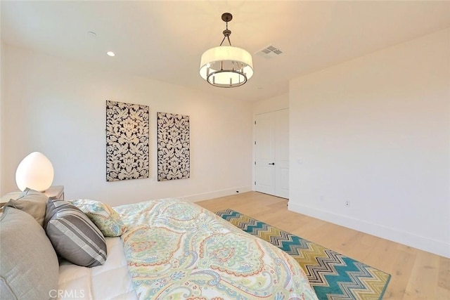 bedroom with hardwood / wood-style floors