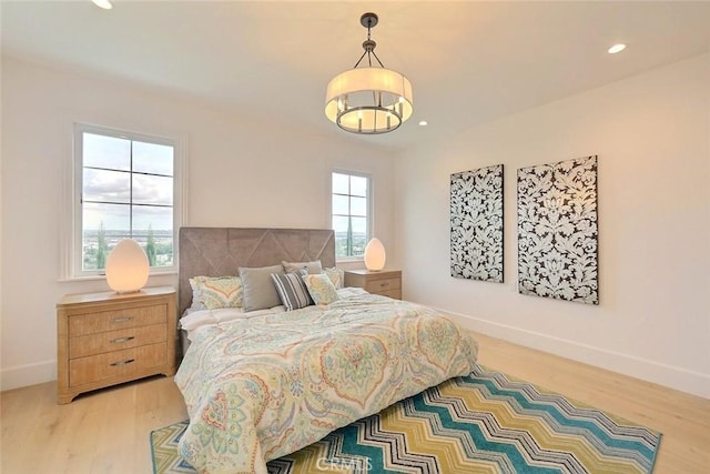 bedroom with light hardwood / wood-style flooring