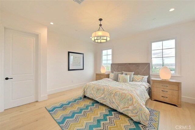 bedroom featuring light hardwood / wood-style floors