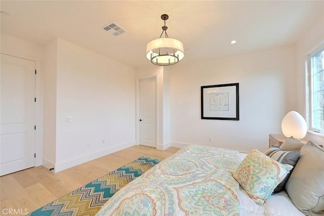 bedroom with hardwood / wood-style floors