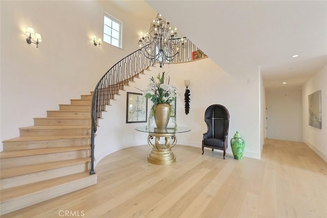 interior space featuring wood-type flooring and an inviting chandelier