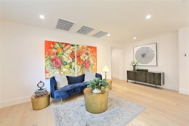 living area with wood-type flooring