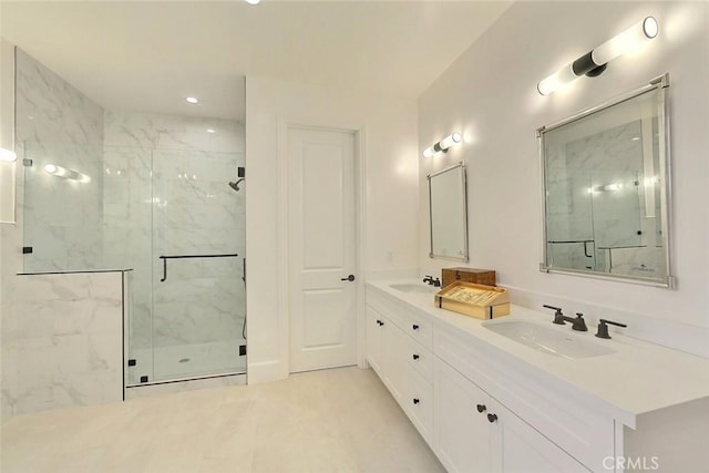 bathroom with vanity and a shower with shower door