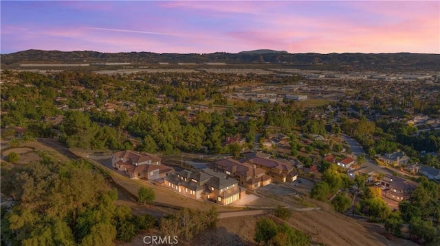 aerial view at dusk with a mountain view