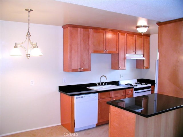 kitchen with sink, a notable chandelier, pendant lighting, white appliances, and light tile patterned floors