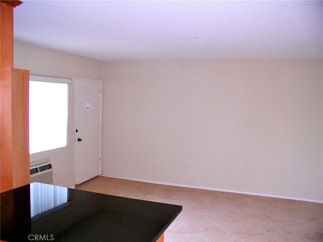 entrance foyer with an AC wall unit