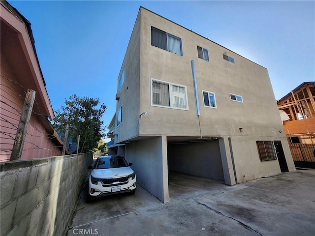 rear view of house with a garage