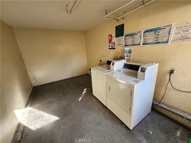 clothes washing area featuring washing machine and clothes dryer