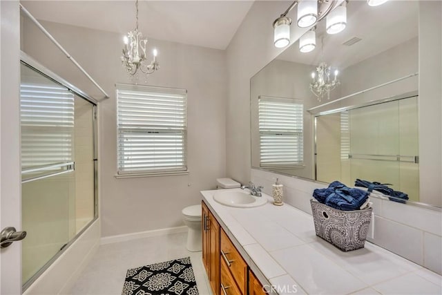 full bathroom with toilet, combined bath / shower with glass door, tile patterned floors, and plenty of natural light