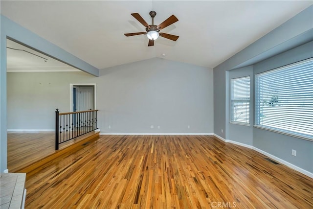 unfurnished room with light wood-type flooring, lofted ceiling, and ceiling fan