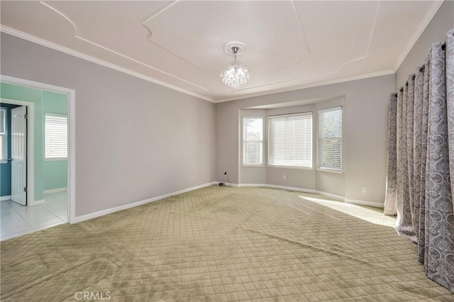 empty room featuring light colored carpet, an inviting chandelier, and ornamental molding