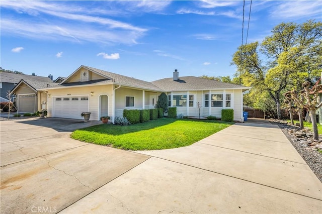 single story home with a garage and a front lawn