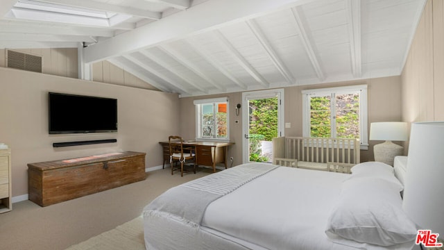 carpeted bedroom featuring vaulted ceiling with beams and access to exterior