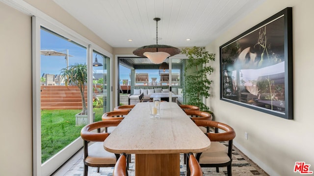 dining room featuring hardwood / wood-style flooring and a wealth of natural light