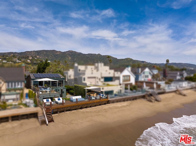 exterior space featuring a water and mountain view