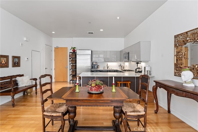 dining room featuring light hardwood / wood-style flooring