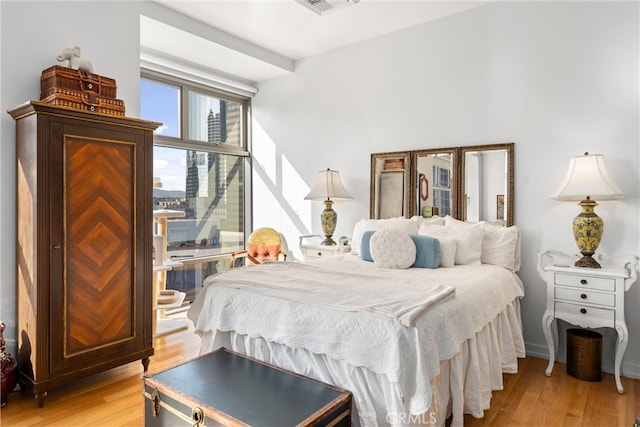 bedroom with light wood-type flooring