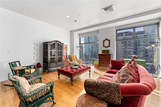 living room with light hardwood / wood-style flooring