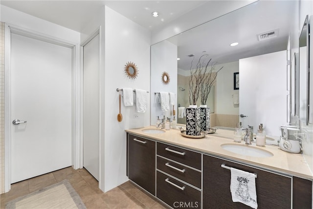 bathroom with vanity and tile patterned floors