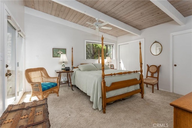 carpeted bedroom featuring ceiling fan, wood ceiling, and vaulted ceiling with beams