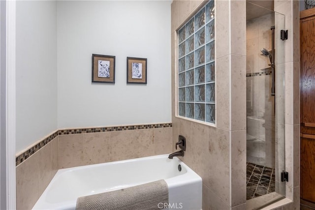 bathroom featuring plus walk in shower