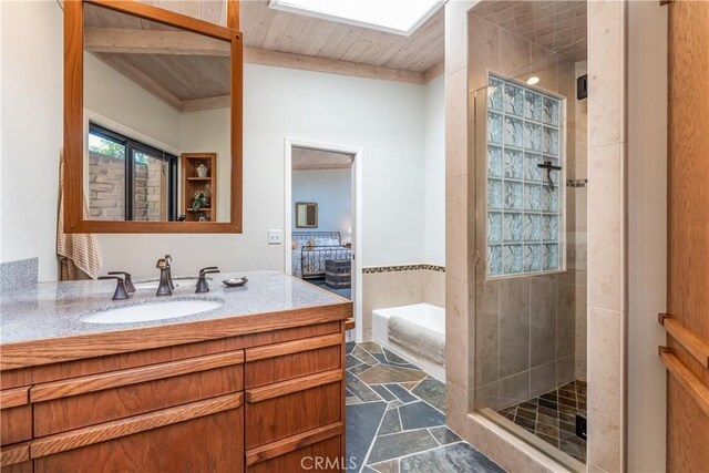 bathroom with vanity, wood ceiling, and walk in shower