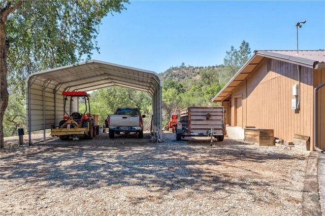 view of parking / parking lot with a carport