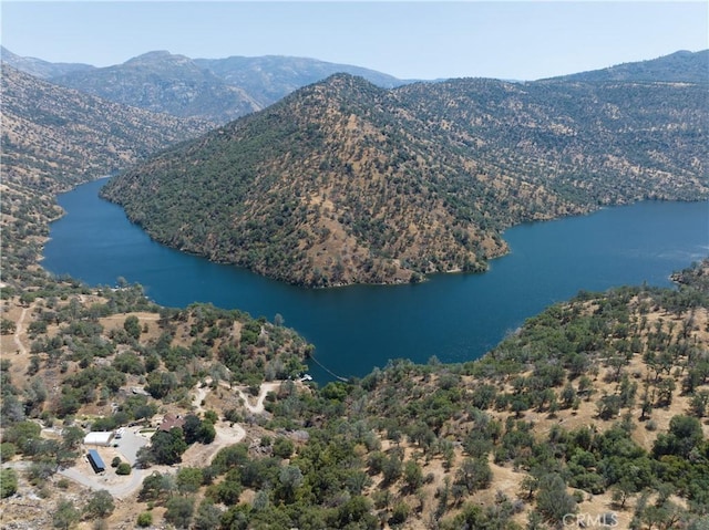 birds eye view of property featuring a water and mountain view