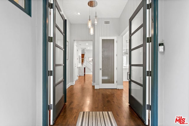 corridor with dark hardwood / wood-style floors