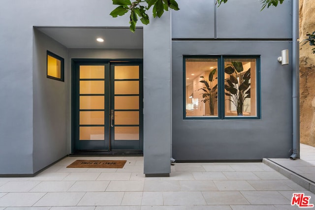 property entrance featuring french doors