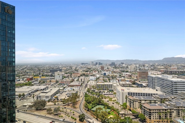 property's view of city featuring a mountain view