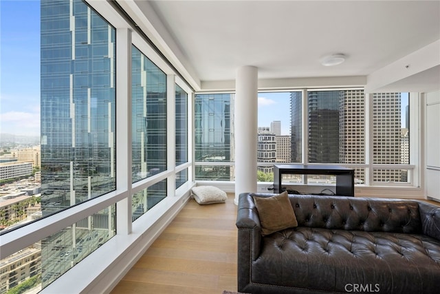 sunroom / solarium featuring a city view