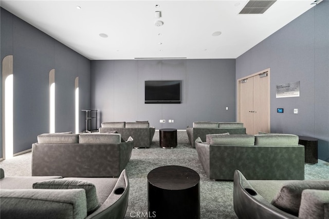 home theater with carpet floors and visible vents