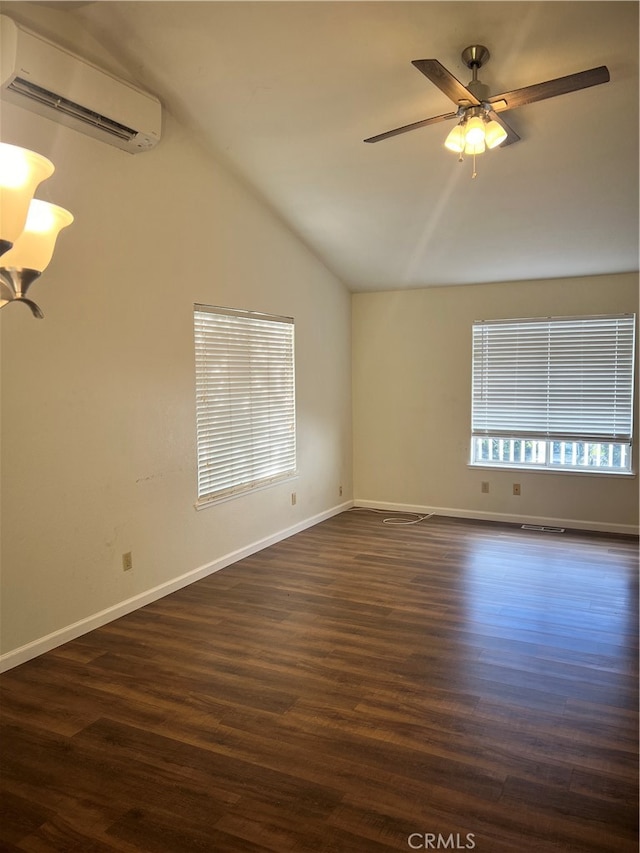 unfurnished room with dark hardwood / wood-style flooring, lofted ceiling, ceiling fan, and a wall mounted AC