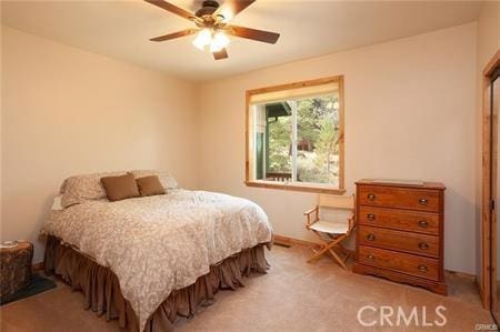 bedroom with light carpet and ceiling fan